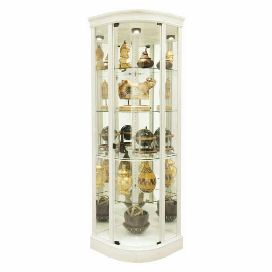 corner curio with curved front glass in an off white finish